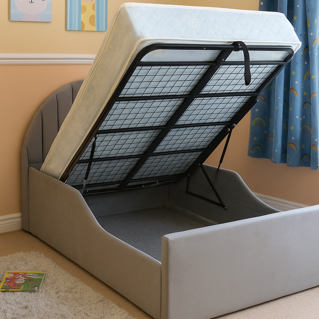 Gray bed with raised mattress and metal frame in a room with blue curtains and children's artwork on the wall.