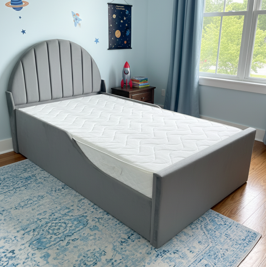 Gray bed frame with white mattress in a room with space-themed wall decorations and a window.