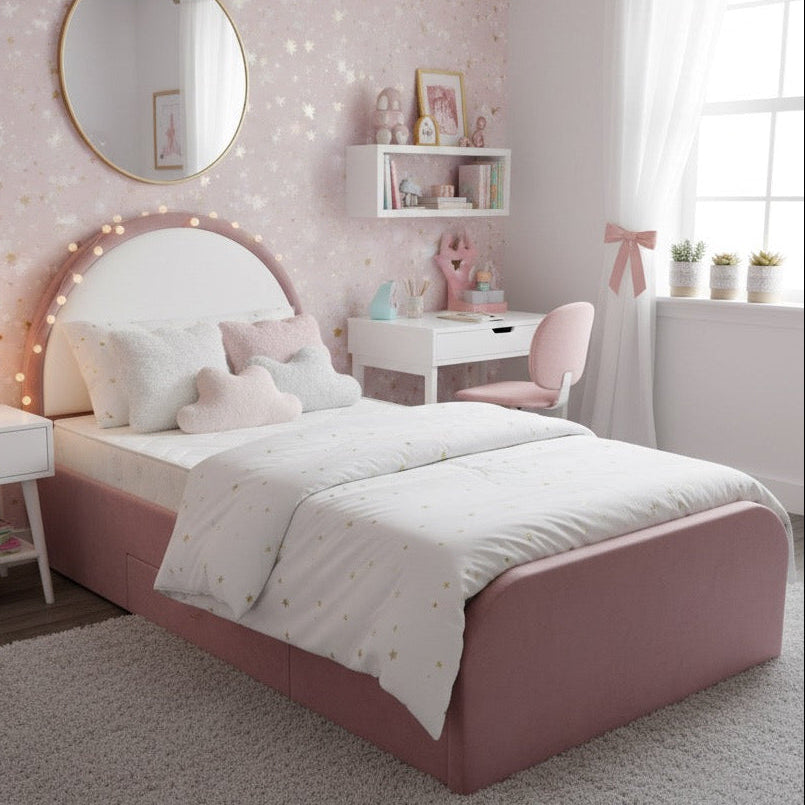 Pink bedroom with a bed, mirror, and desk.
